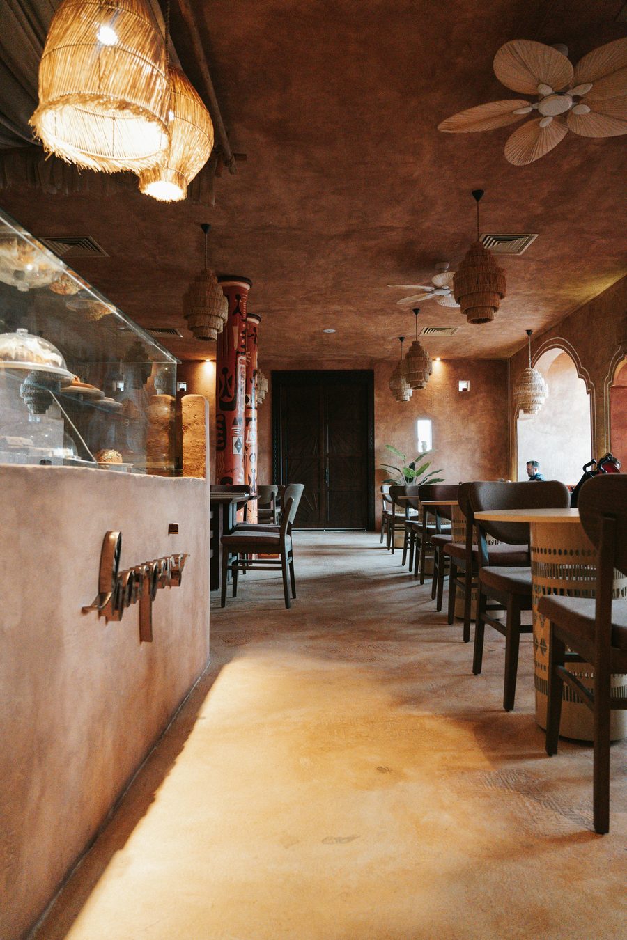 Commercial space with warm terracotta microcement finishes