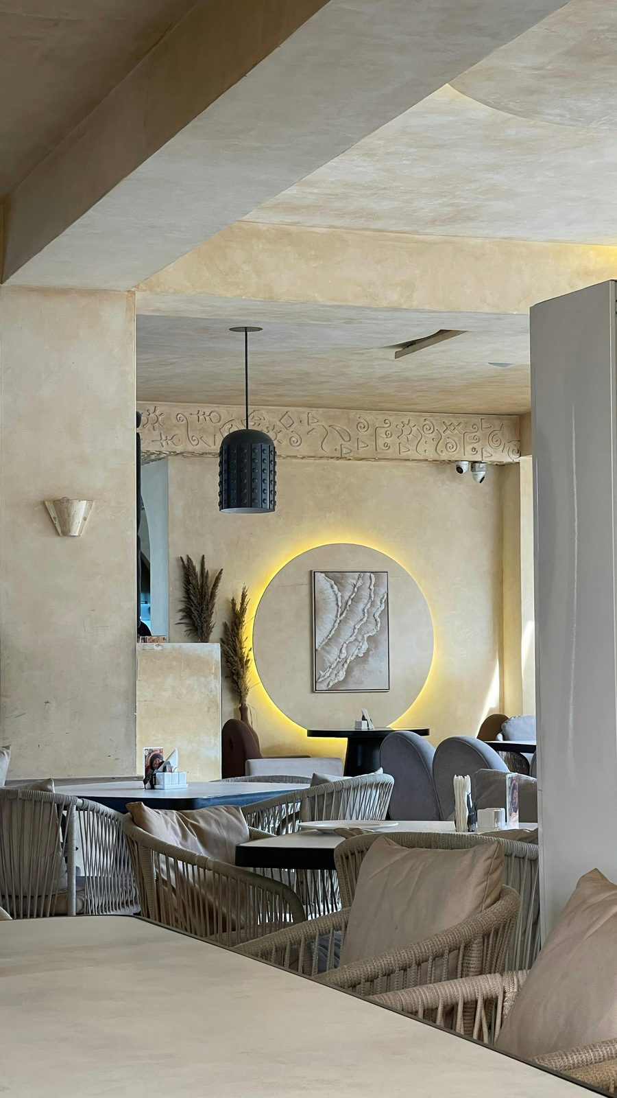 Contemporary restaurant interior with microcement walls and ceiling